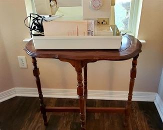 Several antique side tables throughout the house   and Singer Sewing machine