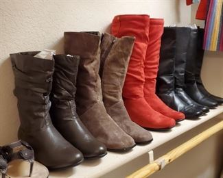 Large walk in closet full of clothes and shoes