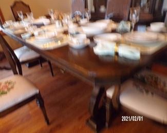 fuzzy shot of dining room table w/several leaves