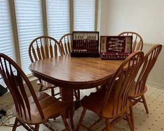 solid oak dining table and six chairs