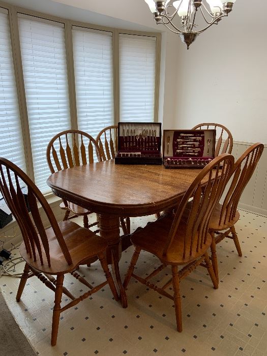 solid oak dining table and six chairs