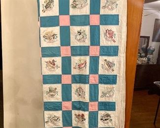 This quilt features hand embroidered 50 state birds!