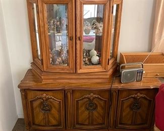 Display case golden oak with mirror back $75. French style Buffett cabinet $100.