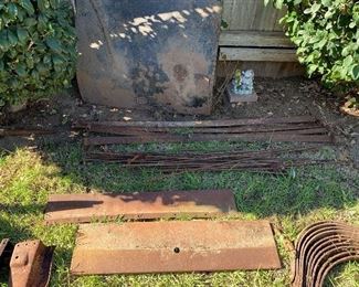 deck lid (leaning against the fence) Unknown leaf springs ( flat pieces below the deck lid, Misc rods for rear of model A 