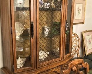 The china cabinet has ample display shelf and storage areas.