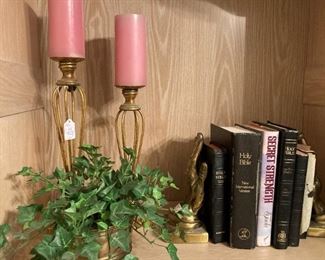 Pink candles; brass candle holders; Bibles