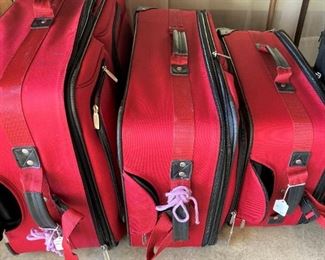 Red luggage ready to travel