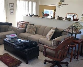 Love seat and sofa - many decoys - many stained glass lamps