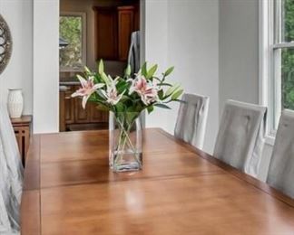 Available for presale - text for price and more info Cherry dining table and 8 chairs (linen chair covers not included)