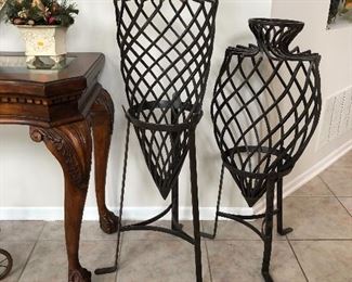 Heavy wrought iron urn on stand for indoor decor or outdoor garden accent