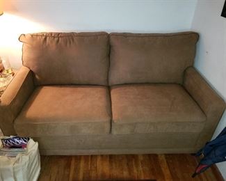 We have two matching La Z Boy sofas. Microfiber with little to no wear.