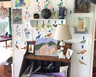 watercolors by Pierrette Hammerling, flip top antique desk, Robert Maxwell Critter, collage by O'Hanlon Great Blue Heron, Round feelie pot weed pot by JD Cruz,  etc