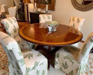 60” round table with rope edge, urn post base, 6 Parson- style chairs, priced separately