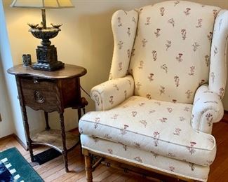 There are a pair of wing back chairs