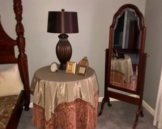 WOODEN TABLE BASE WITH GLASS TOP COVERED IN CLOTH OVER LAYS, STAND MIRROR