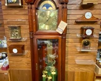 Lot 5000. $900.00 Like New Howard Miller Grandfather Clock. Beautiful wood grain. keeping great  time. This is Model 610-451 with Movement: 354044J.  Howard Miller Clocks are some of the best on the market.  Heirloom quality.  Incomparable workmanship, unsurpassed quality and a quest for perfection. It’s what Howard C. Miller insisted on when he founded the company back in 1926. Howard Miller clocks offer Quality, Selection and Value.  24" W  x  84" H  x 14.5" D Scroll down to Lot 5000 for additional photos.