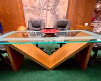 Lot 5001.  $750.00  Glass Conference Table. w/oak "M" Base and Chrome Accents. So much Potential. 84"L x 42"W x 29.5"H w/ 3/4" thick glass. Very sturdy and glass in etched around the edge of the glass. Chairs are sold separately in next lot.