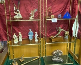 Lot 5007.  $750.00  2 Vintage Brass Etagere 4 Tier display units. Hello amazing plant stand or bones of a cool zoom background!  The metal frame has a bamboo motif, the glass pieces are smoked, all in pretty good shape too. This would be an easy refinish project. I am imagining spray painting in a matte black or matte gold.  The contents of the shelves will be for sale in later lots.	27"W  x  14" D  x  68"H