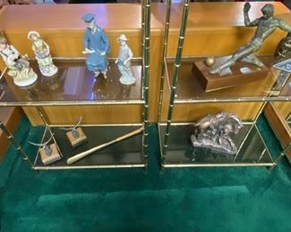 Lot 5007.  $750.00  2 Vintage Brass Etagere 4 Tier display units. Hello amazing plant stand or bones of a cool zoom background!  The metal frame has a bamboo motif, the glass pieces are smoked, all in pretty good shape too. This would be an easy refinish project. I am imagining spray painting in a matte black or matte gold.  The contents of the shelves will be for sale in later lots.	27"W  x  14" D  x  68"H