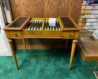 Lot 5010   $275.00  Vintage Desk, Chess and Backgammon Game table. The reversible desk and chess board top slides in and out for neat storage.  Also has two drawers 36" W x 22" D  x 29.5" H.  Great vintage game table. Needs some TLC but very good condition overall.  