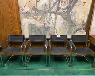 Lot 5009  $1,400.00  Retro MCM Set of 4 Effezeta Italian Black Leather and Chrome Cantilever Style chairs.  Made in Italy, super mod, real cool. Slings are Leather as well as the  leather arm rests.  Chrome base is very solid. 22.5" W  x 30" H x 15" seat height x 23" front to back. Only 1 Set.  Scroll down to Lot 5009 for more photos.