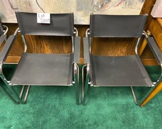 Lot 5009  $1,400.00  Set of 4 Effezeta Italian Black and Chrome Cantilever Style chairs.  Made in Italy, super mod, real cool. Slings are Leather as well as the  leather arm rests.  Chrome base is very solid. 22.5" W  x 30" H x 15" seat height x 23" front to back. Only 1 Set.