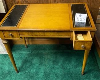 Lot 5010   Desk, Chess and Backgammon Game table. Lot 5010   $275.00  Vintage Desk, Chess and Backgammon Game table. The reversible desk and chess board top slides in and out for neat storage.  Also has two drawers 36" W x 22" D  x 29.5" H.  Great vintage game table. Needs some TLC but very good condition overall.  Leather was dry so we used Lexol leather cleaner to bring it back.