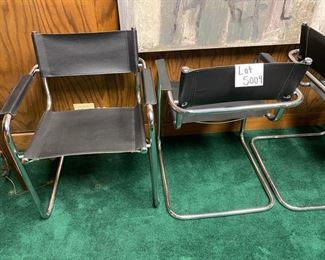 Lot 5009  $1,400.00  Set of 4 Effezeta Italian Black and Chrome Cantilever Style chairs.  Made in Italy, super mod, real cool. Slings are Leather as well as the  leather arm rests.  Chrome base is very solid. 22.5" W  x 30" H x 15" seat height x 23" front to back. Only 1 Set.