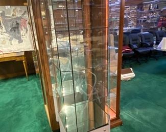 Lot 5012. $450.00   Very Cool Contemporary Lighted  Glass Display Case w/ 4 shelves and Lower Level Storage. Branded Swarovski "Crystal Zoo".  Show off your Swarovski Collection or dazzle your customers with this complete Display case.19.5" W  x 19" D x 72" H