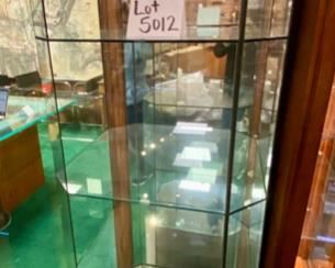 Lot 5012. $450.00   Very Cool Contemporary Lighted  Glass Display Case w/ 4 shelves and Lower Level Storage. Branded Swarovski "Crystal Zoo".  Show off your Swarovski Collection or dazzle your customers with this complete Display case.19.5" W  x 19" D x 72" H