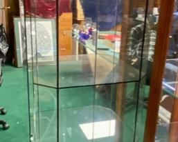Lot 5012. $450.00  Very Cool Contemporary Lighted  Glass Display Case w/ 4 shelves and Lower Level Storage. In-StoreShowroom Branded Swarovski "Crystal Zoo".  Show off your Swarovski Collection or dazzle your customers with this complete Display case.19.5" W  x 19" D x 72" H