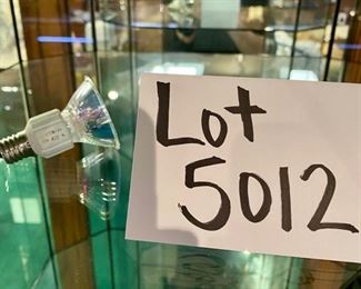 Lot 5012. $450.00   Very Cool Contemporary Lighted  Glass Display Case w/ 4 shelves and Lower Level Storage. Branded Swarovski "Crystal Zoo".  Show off your Swarovski Collection or dazzle your customers with this complete Display case.19.5" W  x 19" D x 72" H