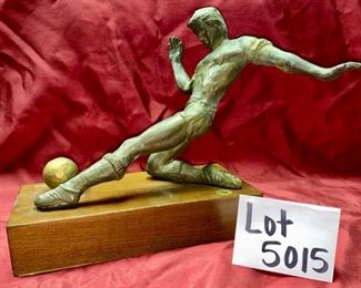 Lot 5015. $115.00  Vintage House of Goebel Patinated Metal of Man Playing Soccer.  Made in Italy with wood base	12" H x 15" W x 12" D.  Very Cool Piece. 