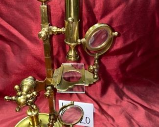 Lot 5020. $195.00  Rare Vintage Brass Reproduction Microscope, Plaque on Stand reads. William - Cary London 1790. Measures approx. 17" tall, base is 5 1/2" round. Great Condition.  William Cary (1759–16 November 1825) was an English scientific-instrument maker. Trained under Jesse Ramsden, he produced numerous scientific instruments including mechanical calculators, measuring instruments, telescopes, microscopes, navigation and survey equipment.