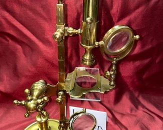 Lot 5020. $195.00  Rare Vintage Brass Reproduction Microscope, Plaque on Stand reads. William - Cary London 1790. Measures approx. 17" tall, base is 5 1/2" round. Great Condition. William Cary (1759–16 November 1825) was an English scientific-instrument maker. Trained under Jesse Ramsden, he produced numerous scientific instruments including mechanical calculators, measuring instruments, telescopes, microscopes, navigation and survey equipment.