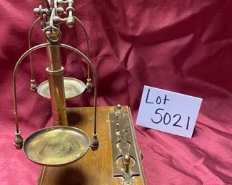 Lot 5021.  $45.00  Brass Scale Apothecary Scale Reproduction on a wood base with one drawer storage for weights. 8" W x 5" D x 12" H