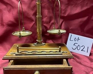 Lot 5021.  $45.00  Brass Scale Apothecary Scale Reproduction on a wood base with one drawer storage for weights. 8" W x 5" D x 12" H