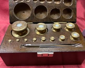 Lot 5022.  $65.00  12 Vintage Complete Metric Weight Set w/wood box 6.25" L  x 3.25" D  x 2.75" H.  Looks vintage and authentic weights.  Nice Condition and in includes a tweezer for placing and removing weights from a Scale.  