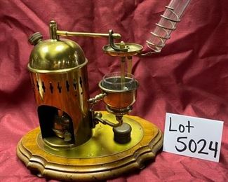 Lot 5024.  $95.00  Very Unique Miniature Brass Distiller w/ wooden base.  12" W x 9" D  x 13" H.  Very unique and  cool piece for a bar display.   