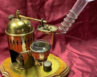 Lot 5024.  $95.00  Very Unique Miniature Brass Distiller w/ wooden base.  12" W x 9" D  x 13" H.  Very unique and  cool piece for a bar display.   