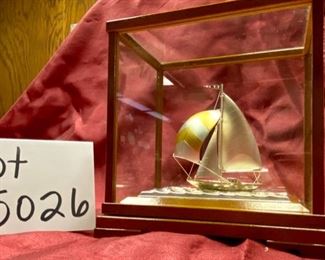 Lot 5026. $60.00 Silver-plated sailboat by Takehiko in Wood and glass case.  6" H  x 6.8  L x  4" W.  Very Good condition overall