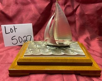 Lot 5027 $50.00 Silver-plated sailboat by Takehiko on  wood base.  6" H  x 6.8  L x  4" W.  Very Good condition overall
