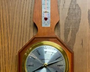 Lot 5028. $75.00  Vintage Airguide Quartz Clock (Battery-Operated), Barometer and Thermometer  25" H  x 7.5" W  wood frame. For Indoor Use Only. 