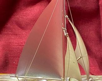 Lot 5027 $50.00 Silver-plated sailboat by Takehiko on  wood base.  6" H  x 6.8  L x  4" W.  Very Good condition overall.