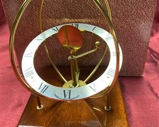 Lot 5052. $20.00  KB Space clock mahogany base. Made in West Germany. 4" D x 4" W x  6" H. Very cool clock.  Just sold these at our last sale...  Only one left.