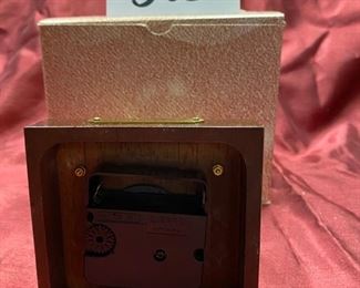 Lot 5052. $20.00  KB Space clock mahogany base. Made in West Germany. 4" D x 4" W x  6" H. Very cool clock.  Just sold these at our last sale...  Only one left.