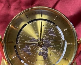 Lot 5062.  $32.00. Benchmark Quartz World Clock in Brass toned metal . 5.5"diameter Face, 7.75" W  x 1.5" D stand. Battery-Operated. Quantity Avail. 3.