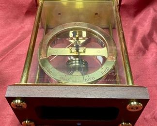 Lot 5068. $150.00.  Vintage Huger Meteobar Barometer in glass case w/brass trim. Displays in millibars vs conventional barometer face, and is more accurate as a result.   VERY HEAVY, Made with Precision in Germany  6.5" W  x  3.75" D  x 10.5" H