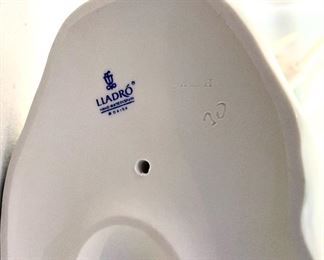 Lot 5031.   $175.00   Lladro Porcelain #1151  "Two Elephants" Mother and Calf. Figurine.  10" W base, 12" H  Mom and  2" H for Calf. Really a cool piece.  Sold on eBay for up to $275.00 