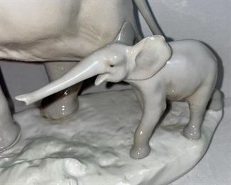 Lot 5031.   $175.00   Lladro Porcelain #1151  "Two Elephants" Mother and Calf. Figurine.  10" W base, 12" H  Mom and  2" H for Calf. Really a cool piece.  Sold on eBay for up to $275.00 